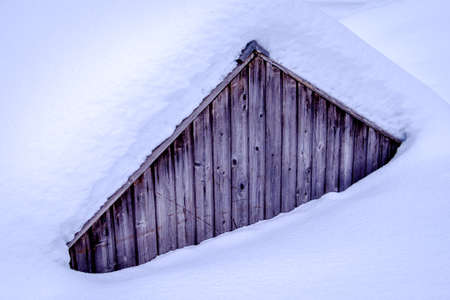old house at the european alps in winterの写真素材