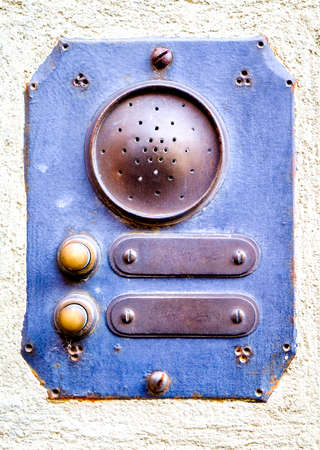 old bell buttons at a wallの写真素材