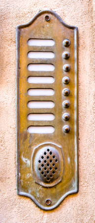 old bell buttons at a wall