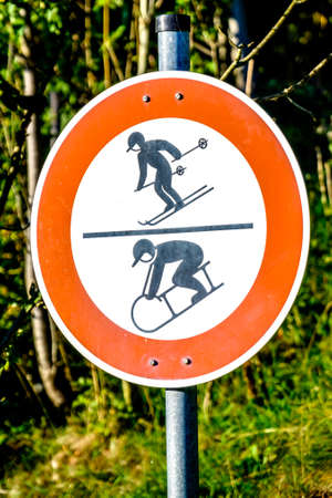 luger and skier warning signの写真素材