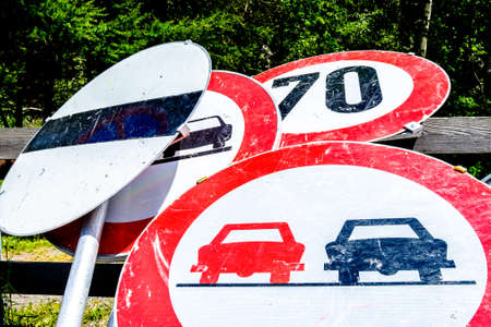 old german road signs at a fence