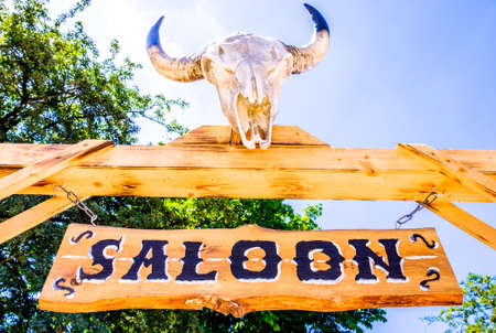 old saloon sign with skullの写真素材