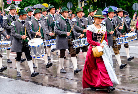 MUNICH, GERMANY - SEPTEMBER 18: people at the opening parade of the oktoberfest on September 18,...