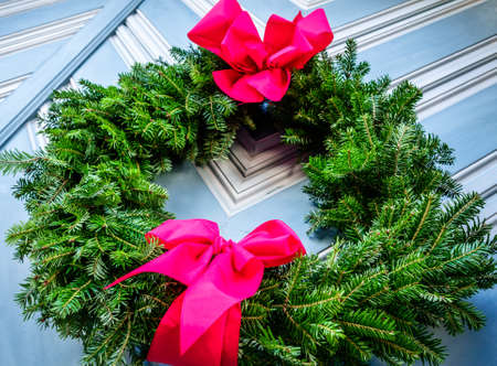 old christmas wreath at a doorの写真素材
