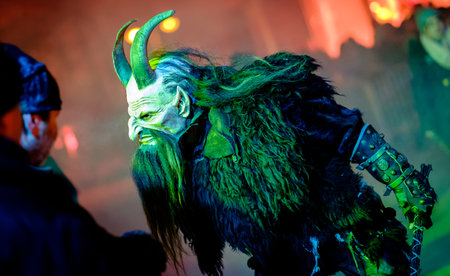 HEIMSTETTEN, GERMANY - DECEMBER 3: traditional krampuslauf with fantasy costumes and wooden masks on...