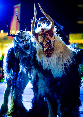 HEIMSTETTEN, GERMANY - DECEMBER 3: traditional krampuslauf with fantasy costumes and wooden masks on December 27, 2017 in Heimstetten, Germanyのeditorial素材