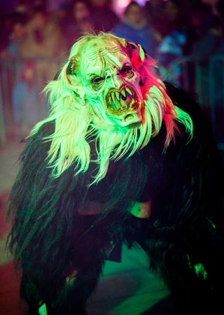 HEIMSTETTEN, GERMANY - DECEMBER 3: traditional krampuslauf with fantasy costumes and wooden masks on...