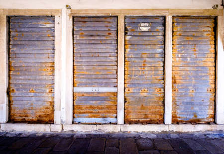 old rundown door at a house in croatiaの写真素材
