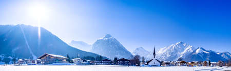 mountains at the village perstisau in austria in winterの写真素材