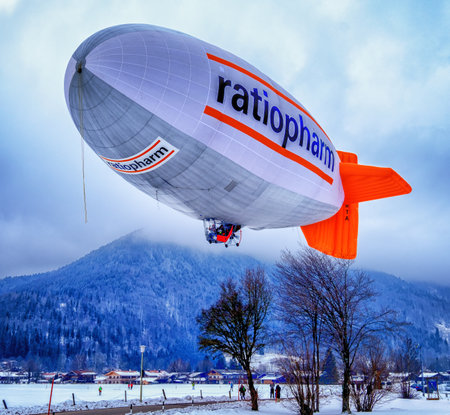 ROTTACH, GERMANY - FEBRUARY 19: blimp (hot air airship) flying at the european alps on feb 19, 2016 in rottach, germanyのeditorial素材