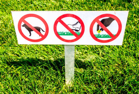 forbidden signs at a meadowの写真素材