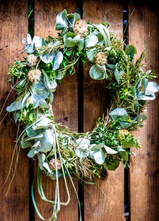 old wreath at a doorの写真素材