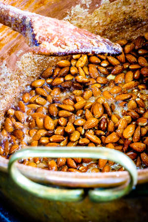 burning almonds at a marketの写真素材