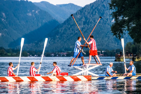 BAD WIESSEE, GERMANY - AUGUST 19: Bavarian competition of two groups with rowboats at a summer...