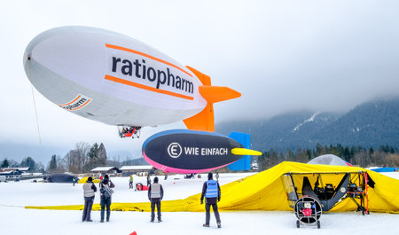 ROTTACH, GERMANY - FEBRUARY 19: blimp (hot air airship) flying at the european alps on feb 19, 2016 in rottach, germanyのeditorial素材