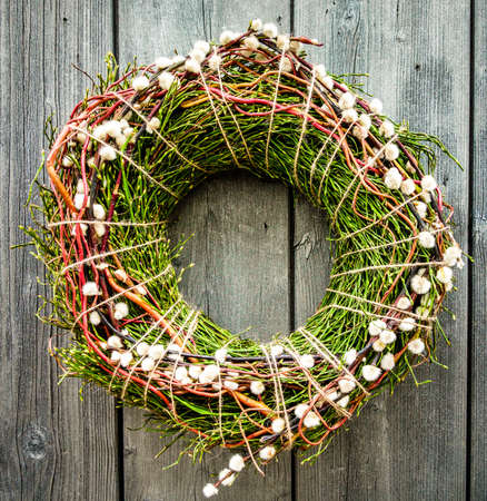 old wreath at a doorの写真素材