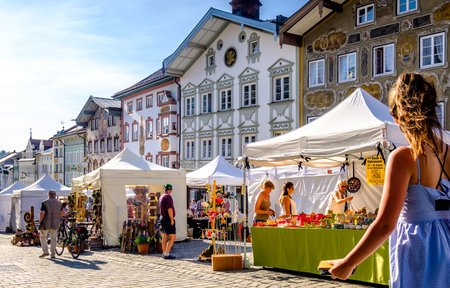 BAD TOELZ, GERMANY - APRIL 21: people visiting the traditional art market with kiosks in the old town on april 21, 2018 in Bad Toelz, Germanyのeditorial素材