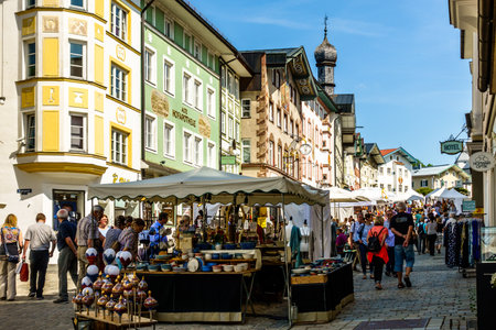 BAD TOELZ, GERMANY - APRIL 21: people visiting the traditional art market with kiosks in the old town on april 21, 2018 in Bad Toelz, Germanyのeditorial素材