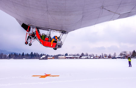 ROTTACH, GERMANY - FEBRUARY 21: blimp (hot air airship) flying at the european alps on feb 21, 2018...