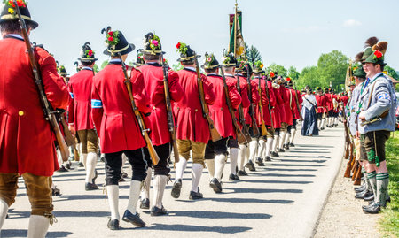 BICHL, GERMANY - MAY 6: a typical traditional bavarian parade for a saints day, called patronatstag, with 4000 gunmen in bichl, germany on may 6, 2018のeditorial素材