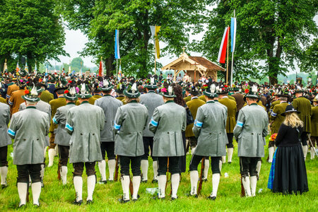 BICHL, GERMANY - MAY 6: a typical traditional bavarian parade for a saints day, called patronatstag, with 4000 gunmen in bichl, germany on may 6, 2018のeditorial素材