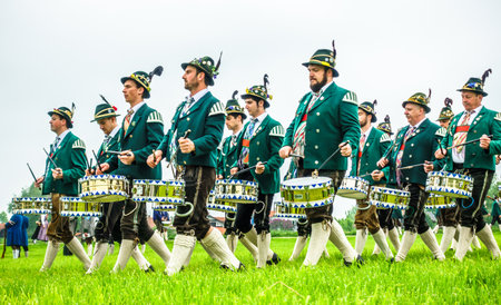 BICHL, GERMANY - MAY 6: a typical traditional bavarian parade for a saints day, called patronatstag, with 4000 gunmen in bichl, germany on may 6, 2018のeditorial素材