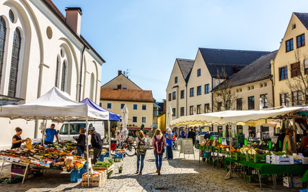 WEILHEIM - BAVARIA, APRIL 17: people visiting and shopping in the famous old town of weilheim in bavaria/germany on april 17, 2018のeditorial素材