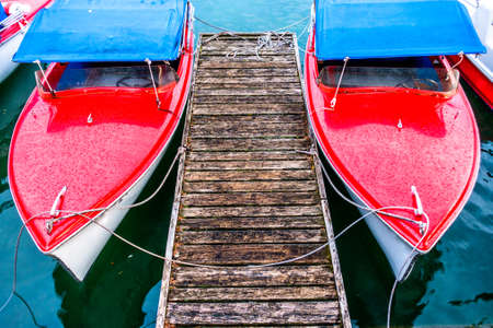 old electric boats at a lake