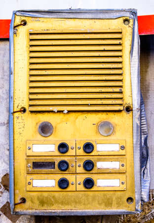 old bell buttons at a wallの写真素材