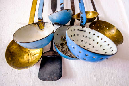 old soup ladles - at a board
