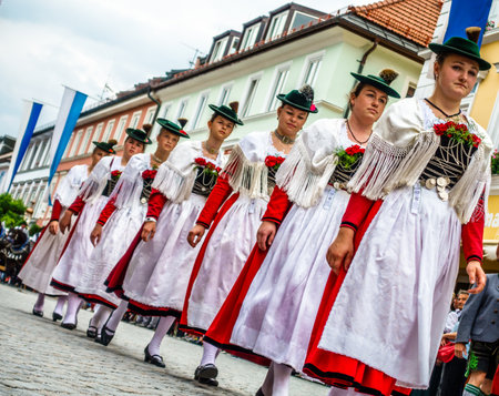 Murnau, Germany - July 8: traditionally dressed bavarians during the parade for the 73rd gaufest in the old town of murnau, germany on july 8, 2018のeditorial素材