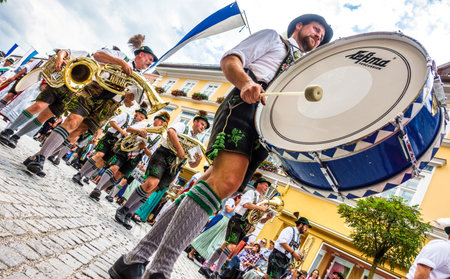 Murnau, Germany - July 8: traditionally dressed bavarians during the parade for the 73rd gaufest in the old town of murnau, germany on july 8, 2018のeditorial素材