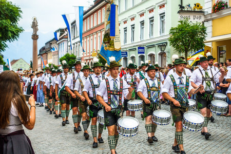 Murnau, Germany - July 8: traditionally dressed bavarians during the parade for the 73rd gaufest in the old town of murnau, germany on july 8, 2018のeditorial素材