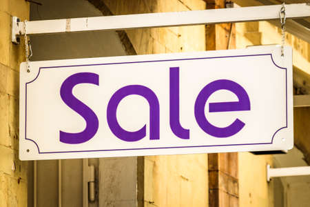 sale sign at a wallの写真素材