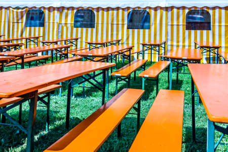 bavarian beergarden - table and benches at a tent