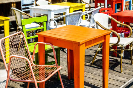 table and chair at a sidewalk cafeの写真素材