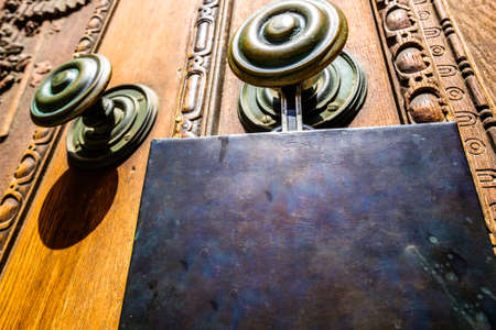 blank sign at a wooden doorの写真素材