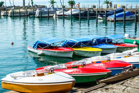 old pedal boat at a lakeの写真素材