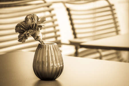 table and chair at a sidewalk cafeの写真素材