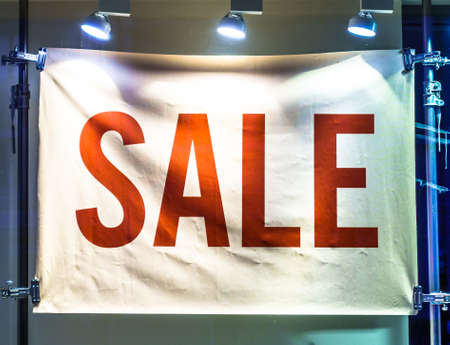 red sale sign at a wallの写真素材