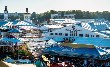 Munich, Germany - September 27: people and fairground rides at the biggest folk festival in the world - the oktoberfest on september 27, 2018 in munich.のeditorial素材