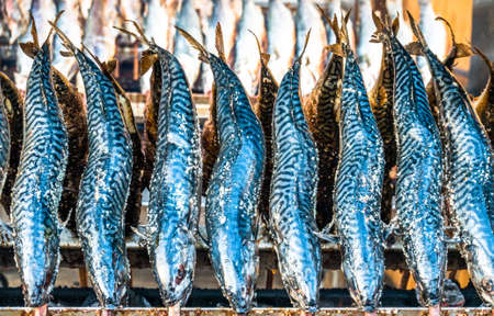 typical bavarian fish on a stick at the oktoberfest - germany
