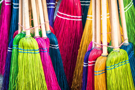 group of old fashioned brooms