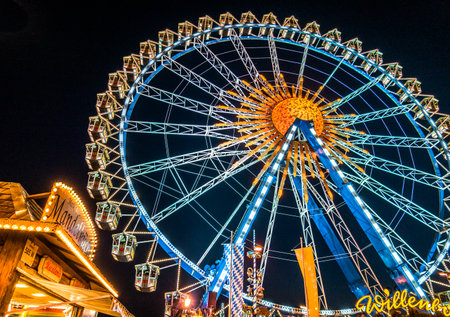 Munich, Germany - September 30: people and fairground rides at the biggest folk festival in the world - the oktoberfest on september 30, 2018 in munich.のeditorial素材
