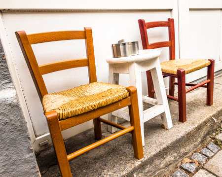 table and chair at a sidewalk cafeの写真素材