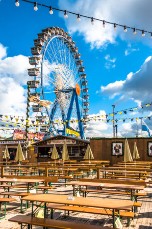 Munich, Germany - October 2: people and fairground rides at the biggest folk festival in the world - the oktoberfest on oktober 2, 2018 in munich.のeditorial素材