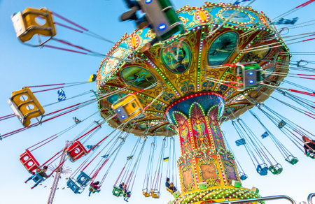 Munich, Germany - October 4: people and fairground rides at the biggest folk festival in the world - the oktoberfest on oktober 4, 2018 in munich.のeditorial素材