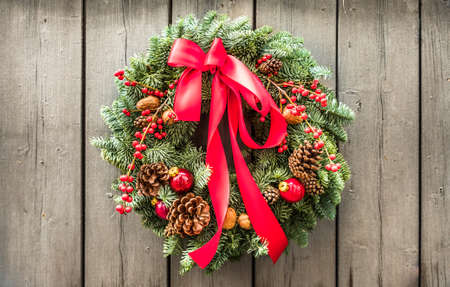 old christmas wreath at a doorの写真素材