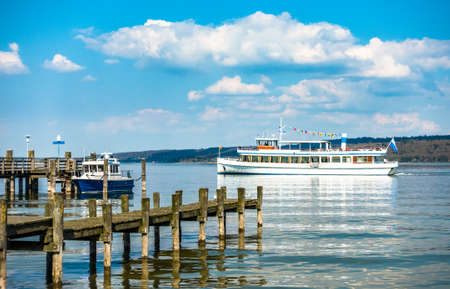 old wooden jetty at the ammersee lake - bavariaの写真素材