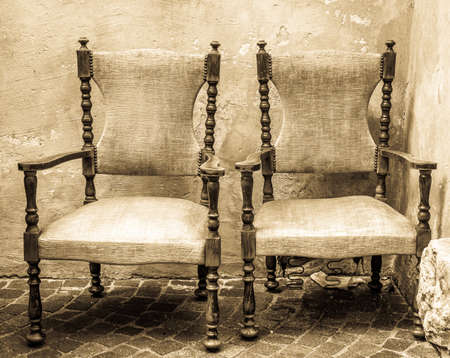 old armchairs in front of wallの写真素材